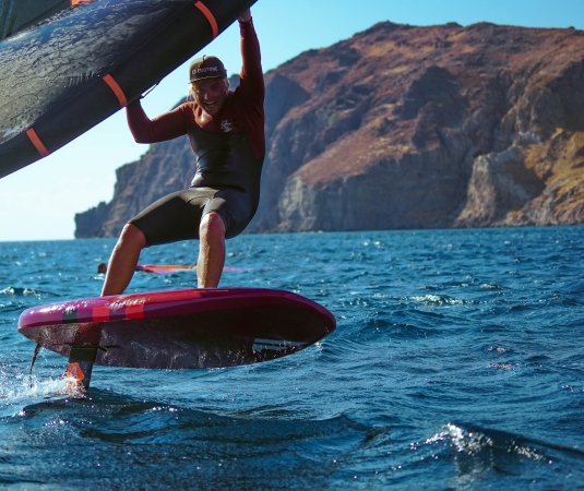 A wing surfer enjoying himself on a sunny day on the water