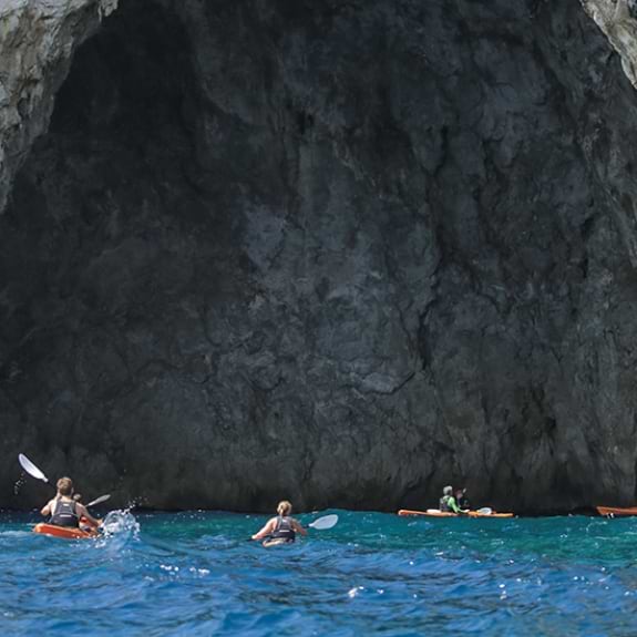 Exploring the caves by sea kayak