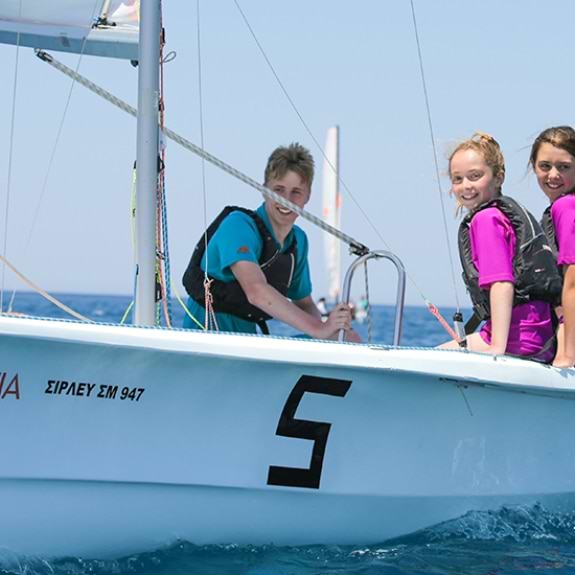Wave Riders sailing a Laser Bahia with instructor on board