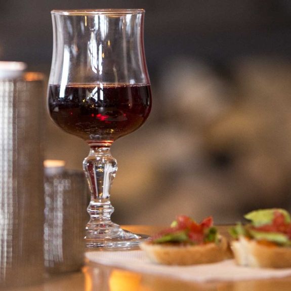 Enjoy a glass of wine by the wood burning stove