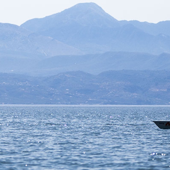 two people sailing Laser Dinghies