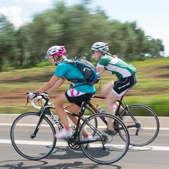 Group of people road biking