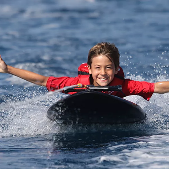 Young boy on kneeboard
