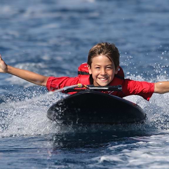 Young boy on kneeboard