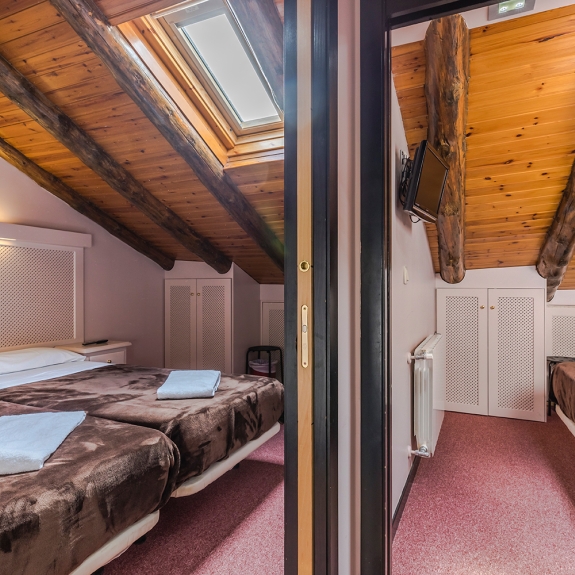 One of the two interconnecting family rooms