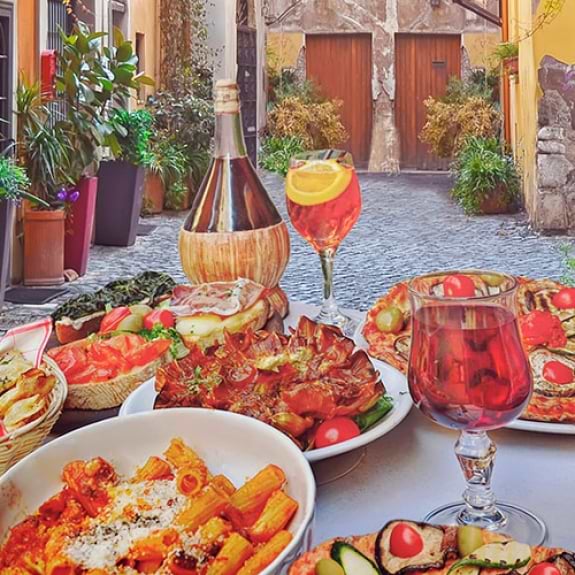 Italian food and drink on a restaurant table