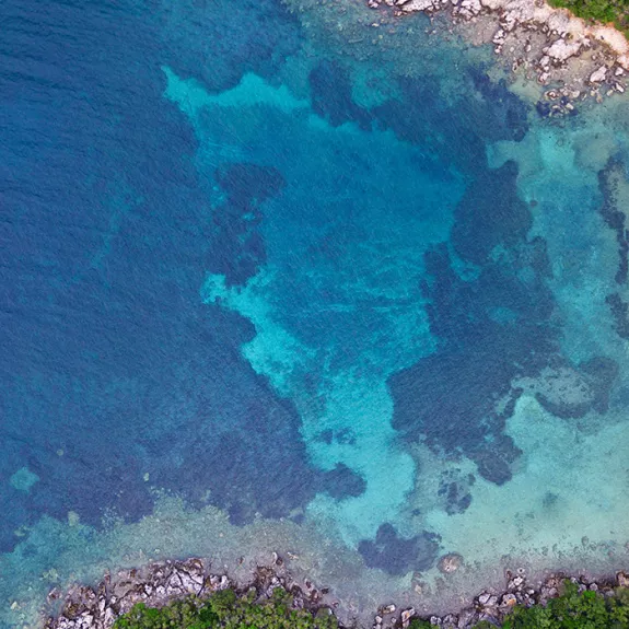 Aerial view of yacht in bay at Sivota, Greece