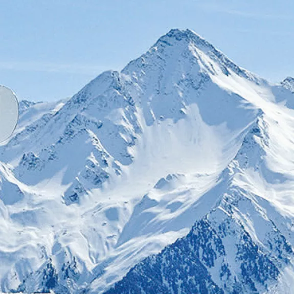 man standing holding a snowboard