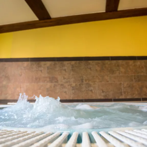 A large hot tub in the wellness area