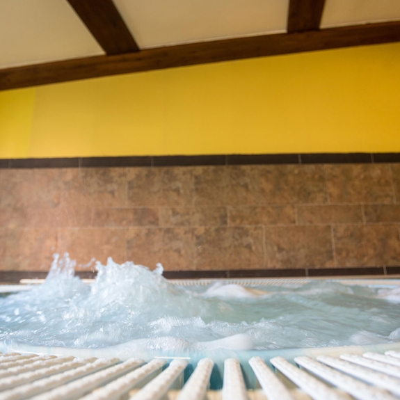 A large hot tub in the wellness area