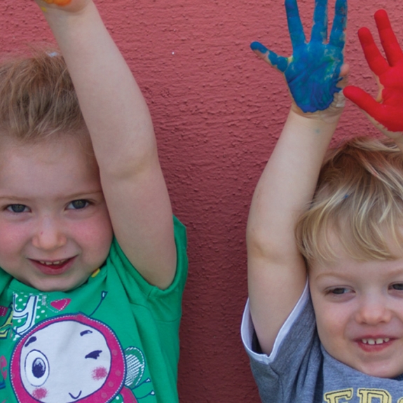 children doing hand painting