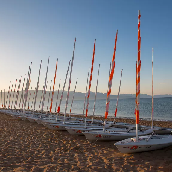 View of dinghies on Messini Beach at sunrise