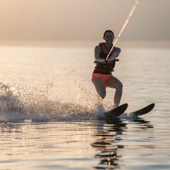 Water skiing at Buca Beach Club
