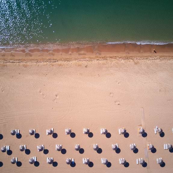 Aerial view of Analipsi beach at Buca Beach Club
