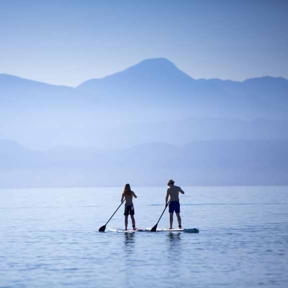 Paddle boarding at Buca Beach Club