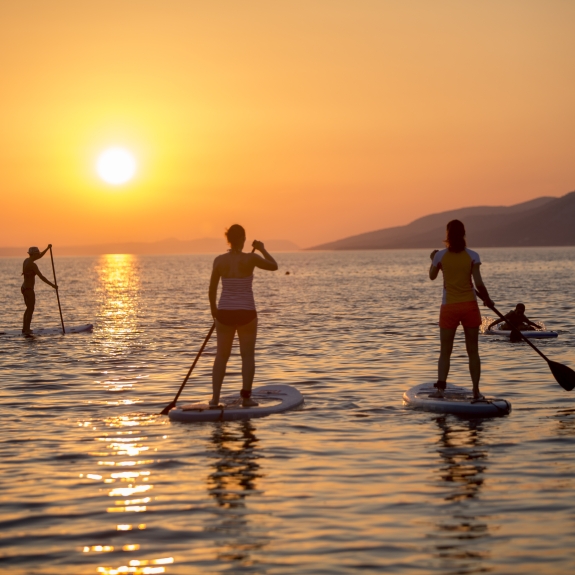 Paddle boarding at Alana Beach Club