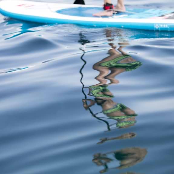 Blue seas, paddle boarding