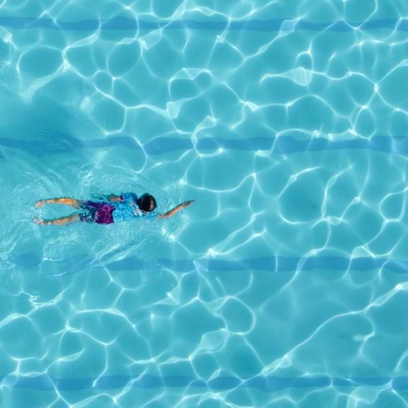Girl swimming front crawl