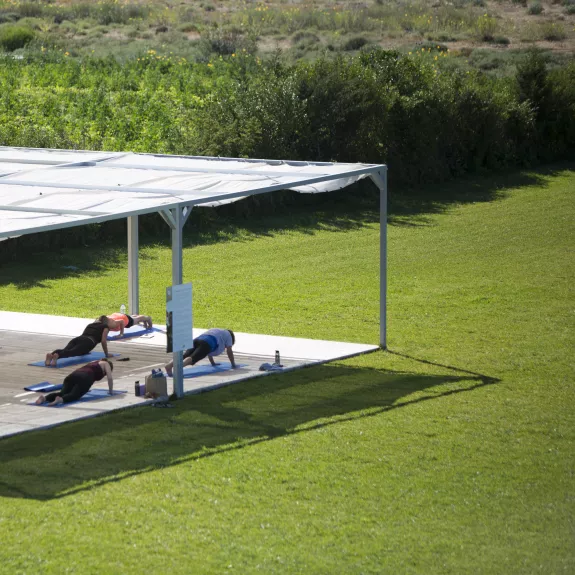 Fitness platform in the gardens at Buca Beach Club