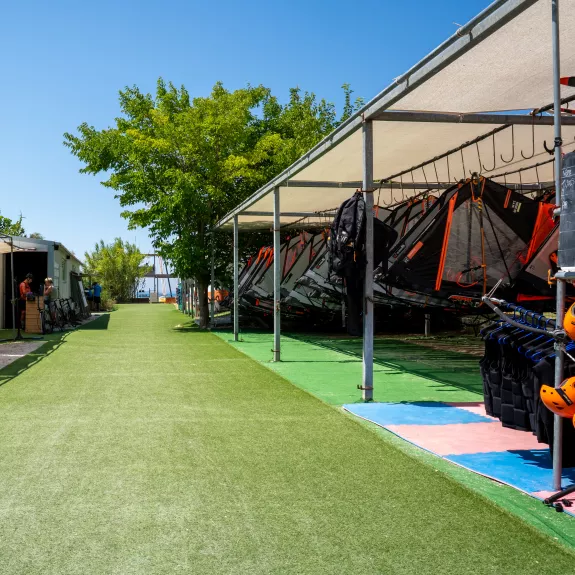 Windsurf and bike racks at Cosmos Beach Club
