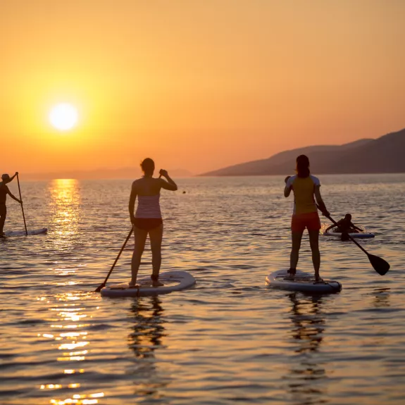 Paddle boarding at Alana Beach Club