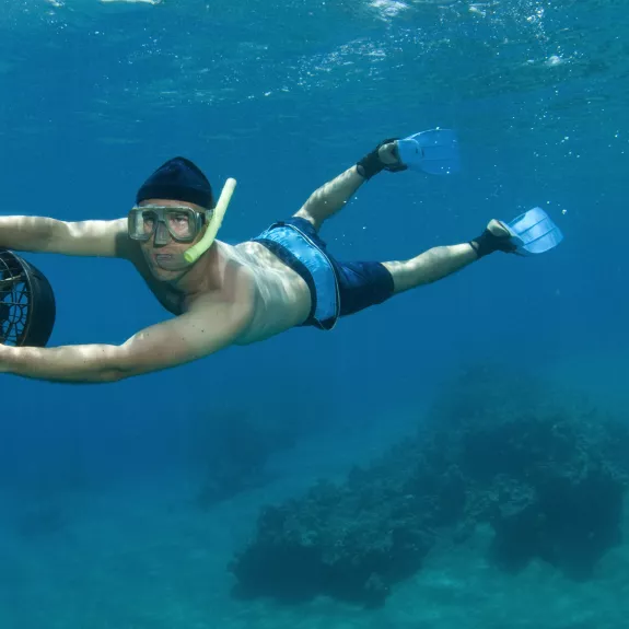 Explore vibrant marine life with sea scooters at Neilson | Cook's Club Adakoy