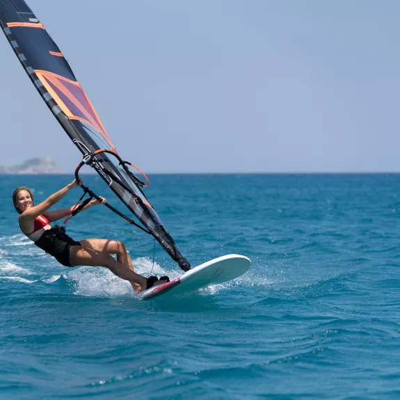 A solo windsurfer