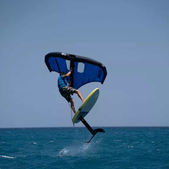 A man wing foiling 