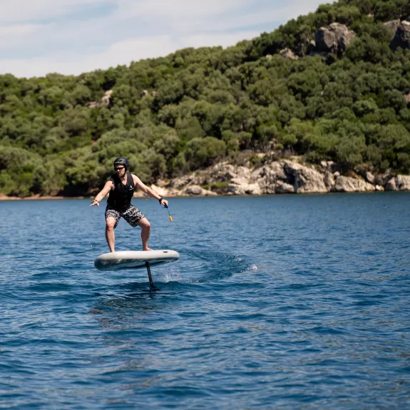a person riding a hydrofoil surfboard