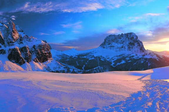 sun rise over Italian mountains covered in snow