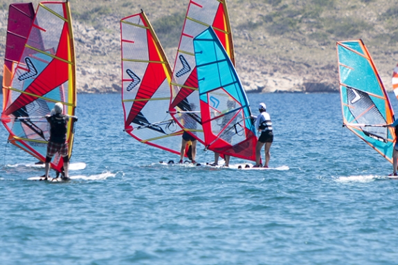 Group of people windsurfing