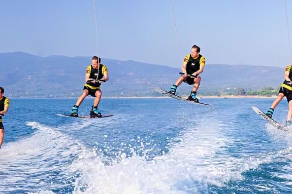 Jumping the boat wake on a wakeboard