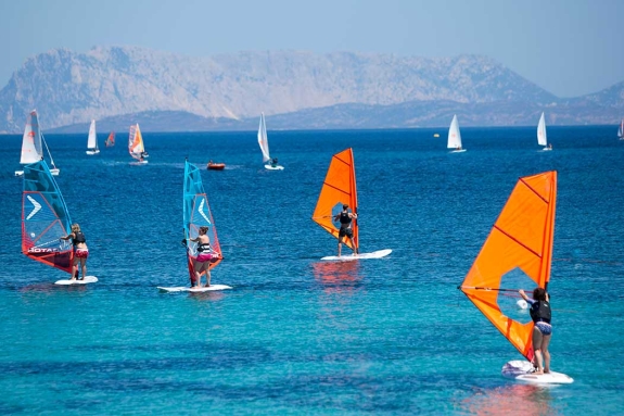 Group of beginners windsurfing