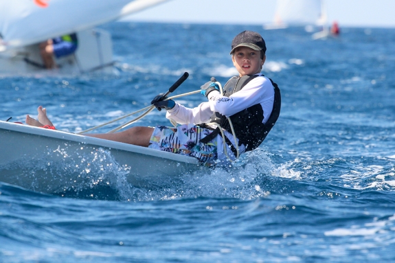young boy dinghy sailing
