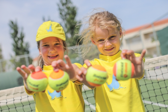 Girls holding tennis balls