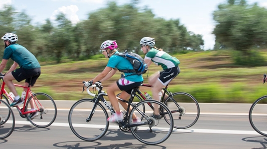 Group of people road biking