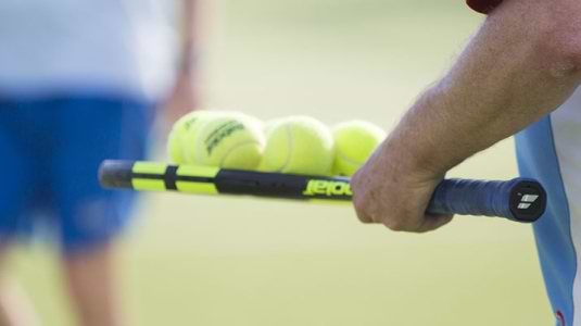 people on tennis court