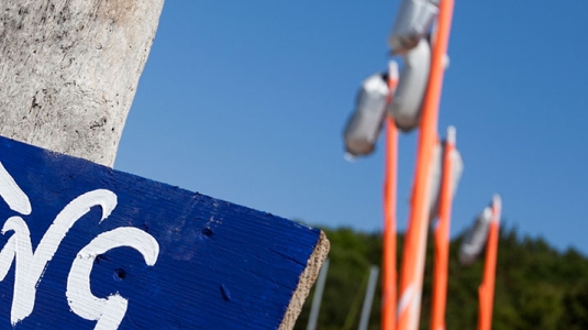Beach and sailing signpost