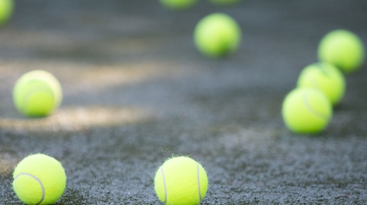 Tennis balls on a tennis court