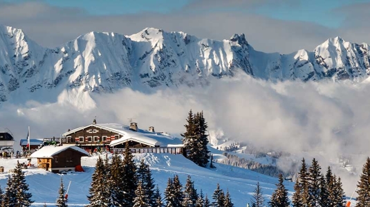 French alps and mountain village covered in snow