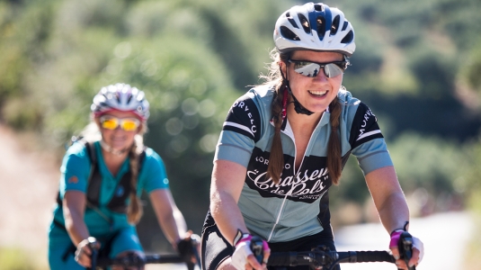 a couple of people on road bikes