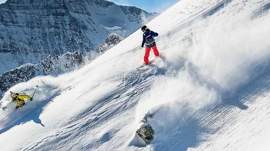 skier and snowboarder