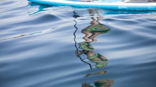 Blue seas, paddle boarding