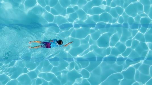 Girl swimming front crawl