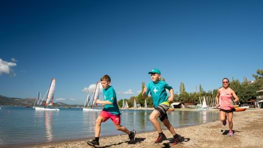 Kids running on a beach