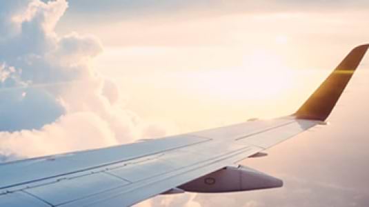 An airplane wing in the sky