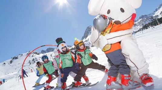 Kids hugging a big white mouse