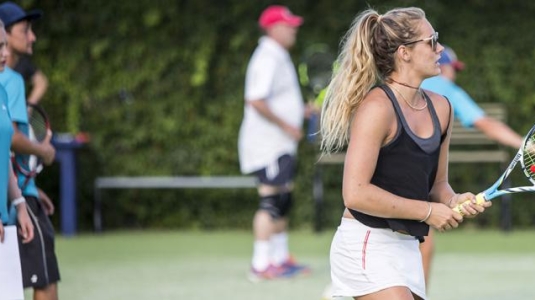 teenage girl playing tennis