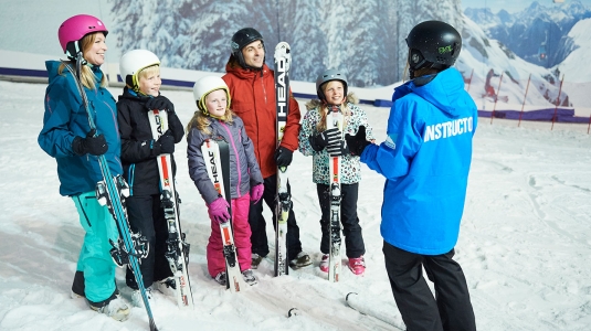family learning to ski