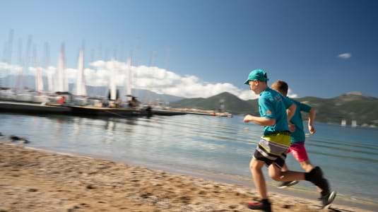 Children running on the waterfront